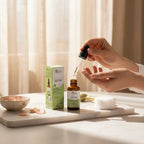 BIOCOS Cosmetics Arbutin Whitening Beauty Serum bottle with dropper and packaging on a marble surface with rose petals