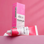 BIOCOS Cosmetics Knuckles Whitening Cream tube and box with white cream on a pink background