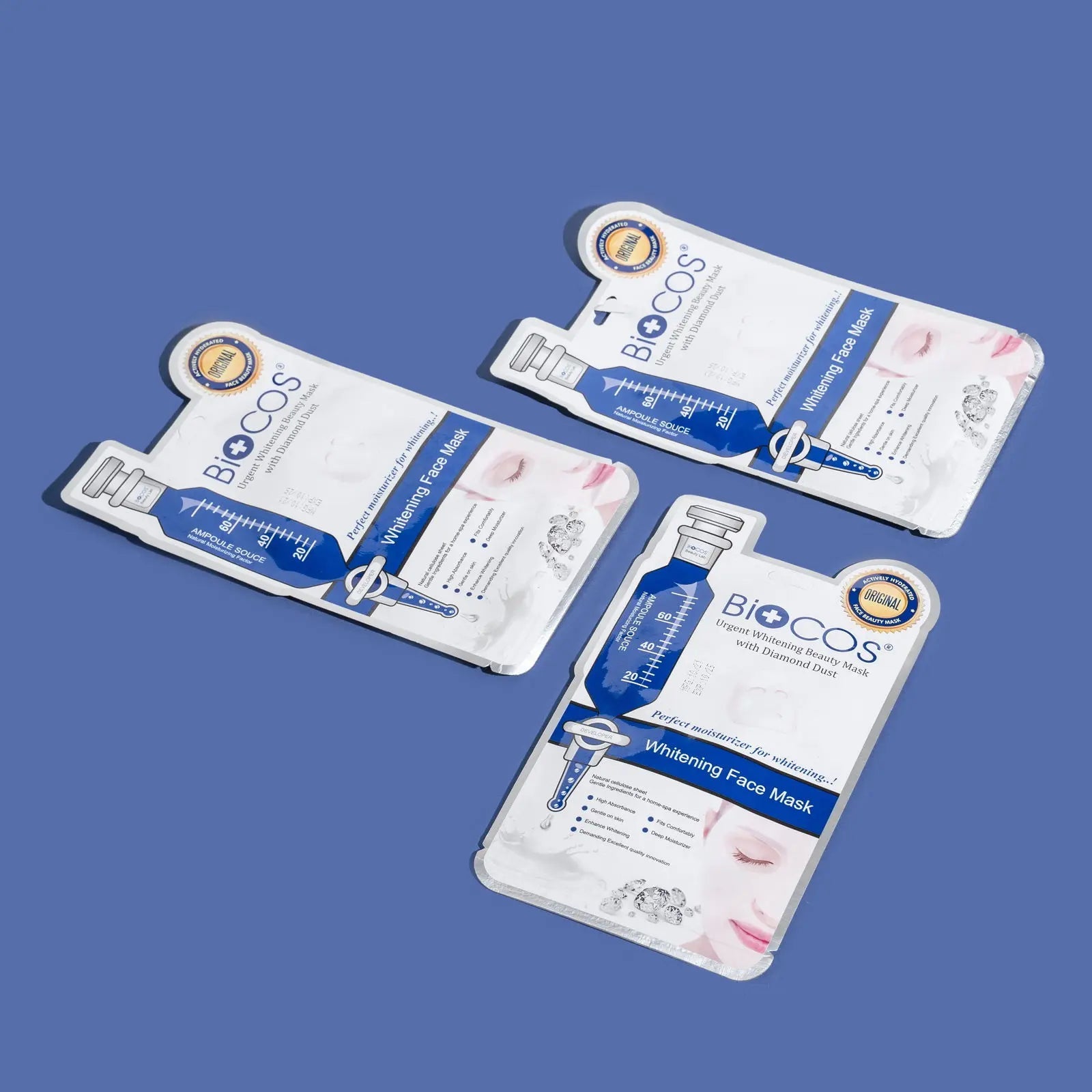 BIOCOS Cosmetics whitening face mask sachets with diamond dust, grape extract, and green tea for radiant skin.